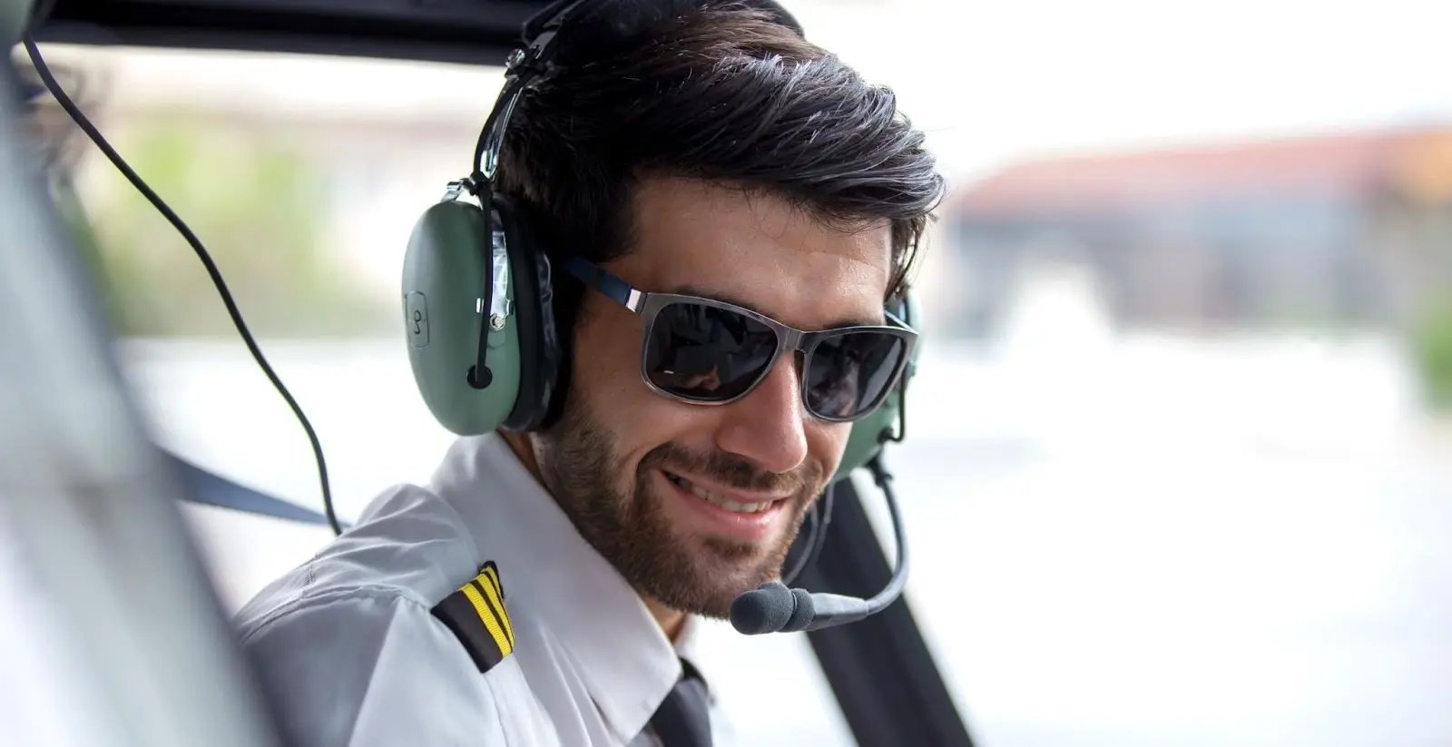 pilot wearing sunglasses and headset (1)